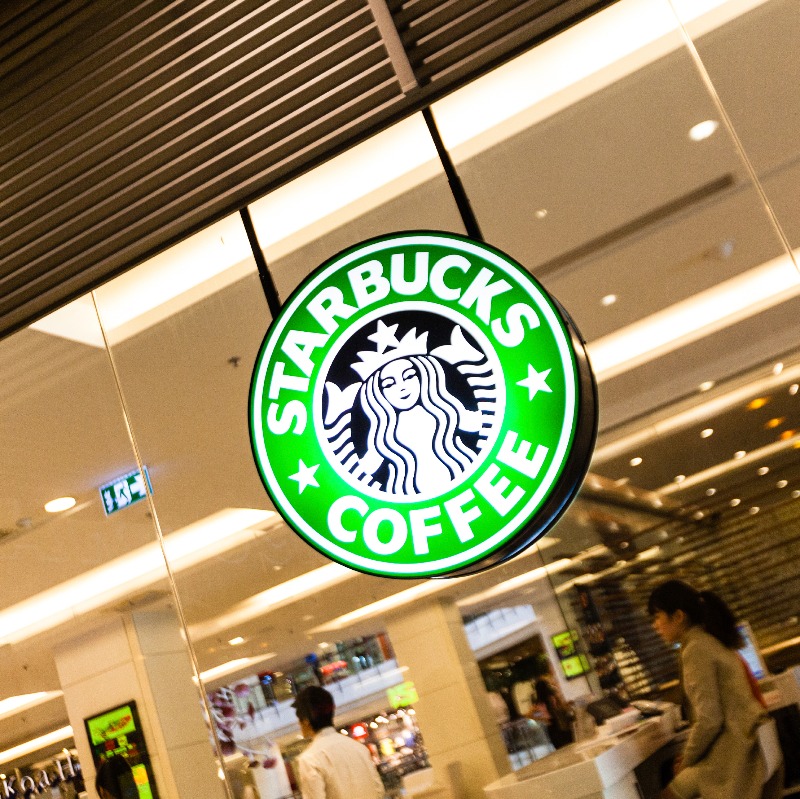 Starbucks logo in front of a coffee shop.