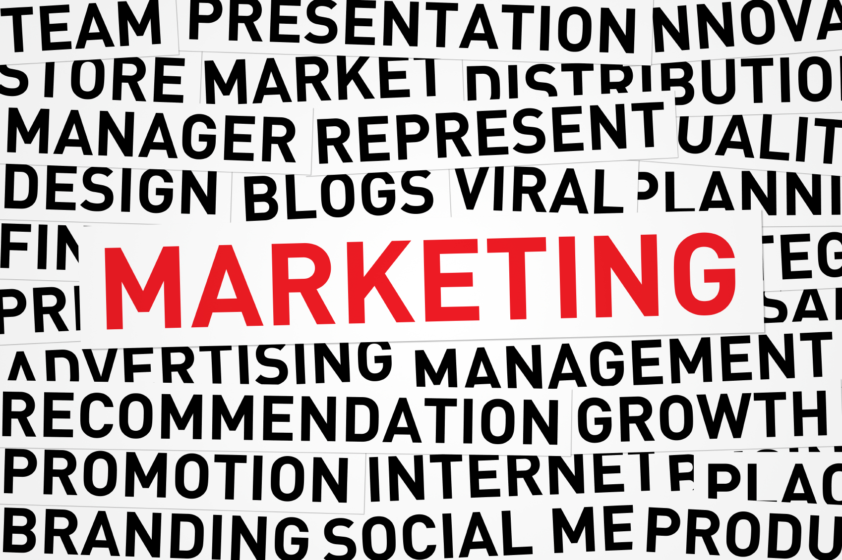 The word Marketing highlighted and surrounded by other words in the background such as manager, promotion, and advertising