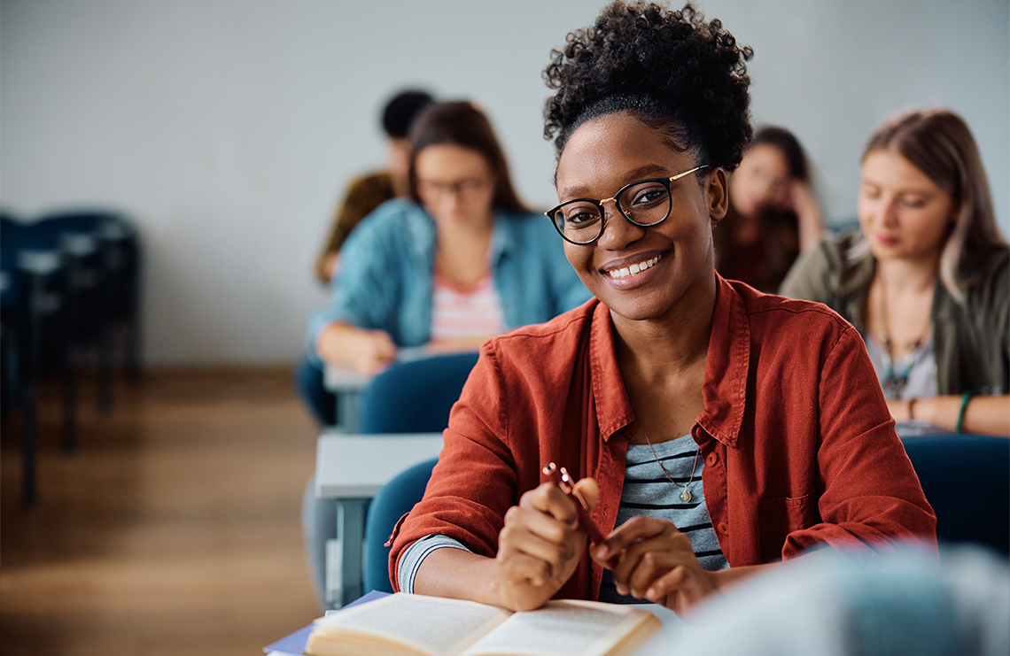 An adult learner in a classroom.