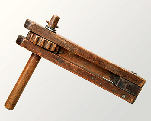 A wooden gas alarm rattle
