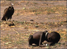 Malnourished baby being stalked by a vulture