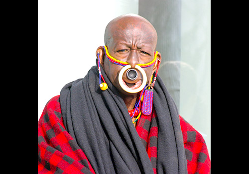 Aboriginal man in Melbourne, Australia with large piercings in his nose and lip.