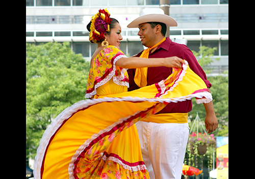 Couple dancing together at Toronto's Hispanic Fiesta festival 