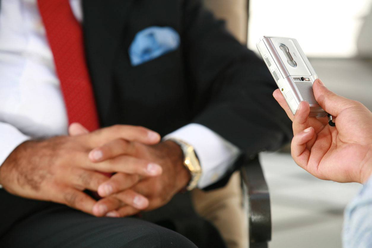 Woman interviewing a man