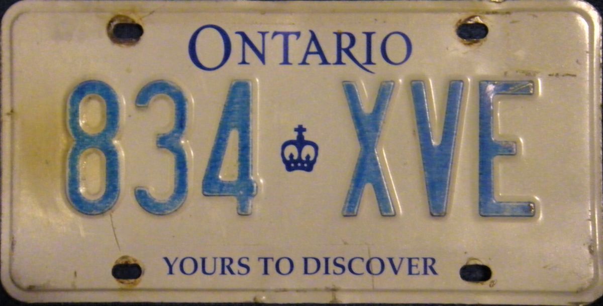 Image of 4 different types of Ontario license plates used between 1982 and the present.