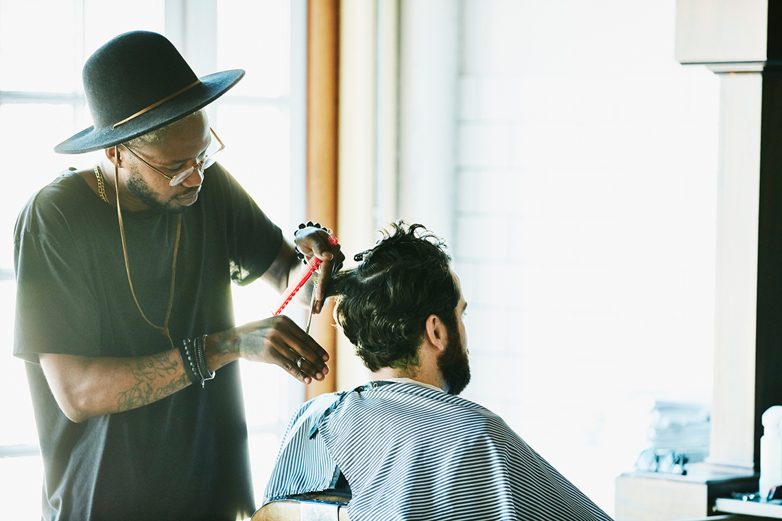 A hairdresser cutting a client's hair