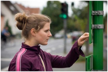 Girl reading a bus sign