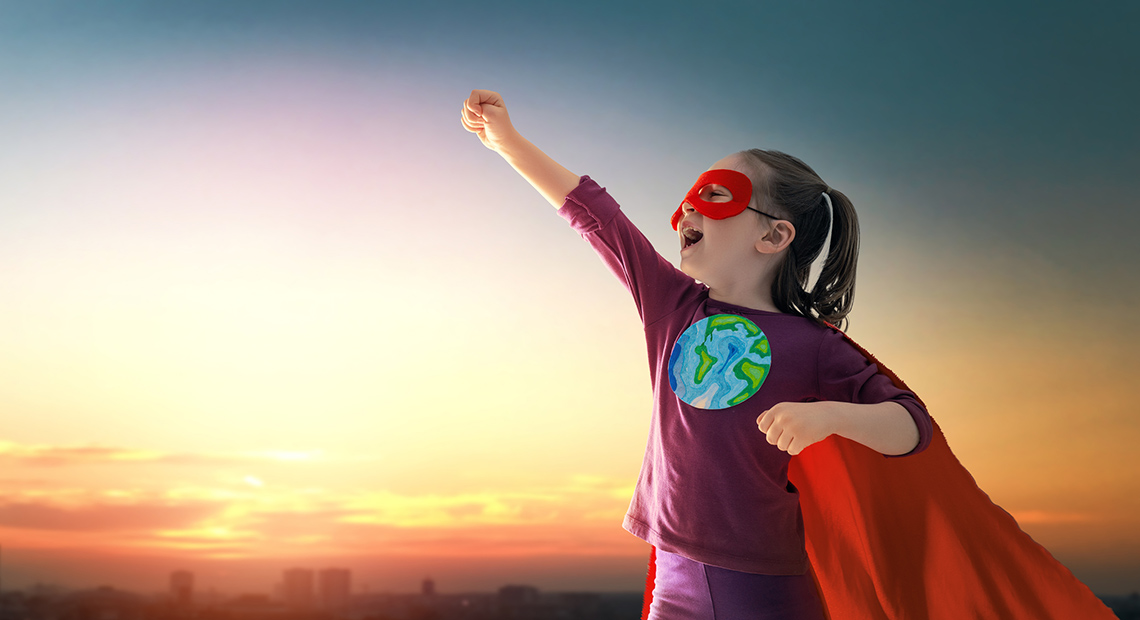 A child dressed as a superhero of Earth