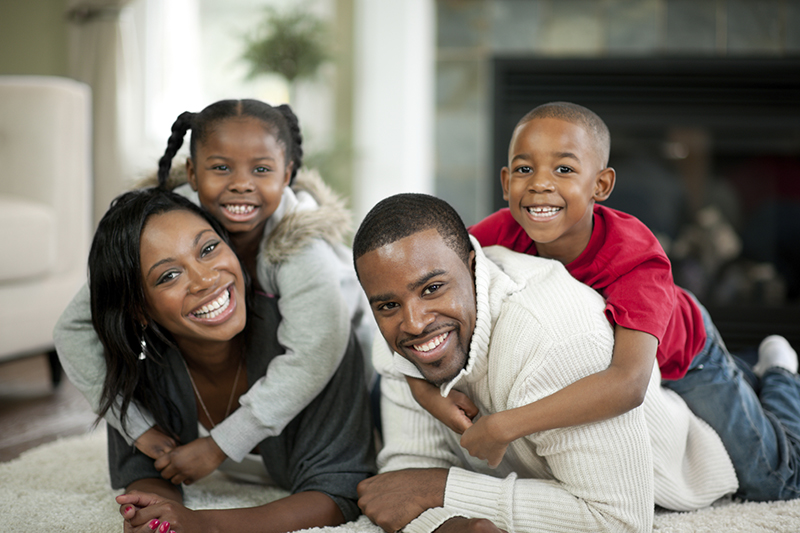 Smiling family playing together